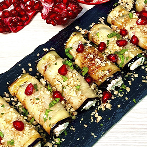 Мини-рулеты из баклажанов с чесноком и орехами